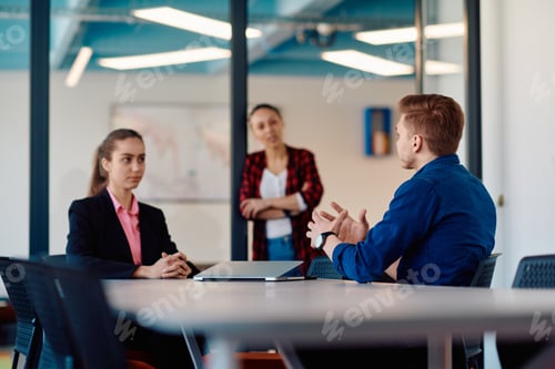 Preview: A team of successful programmers sits in a startup office, strategizing new business projects and