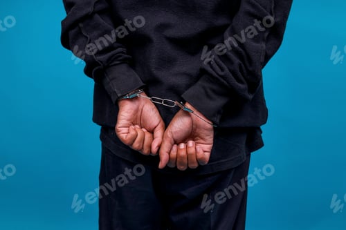 Preview: Close-up Rear View Of Hands In Handcuffs After Getting Arrested For Stealing And Committing A Crime