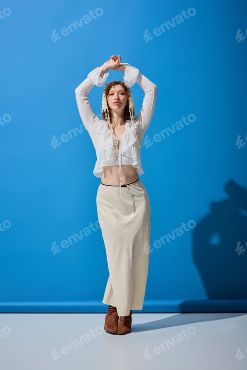 Preview: Curly woman showcases vibrant spring fashion in a chic studio setting