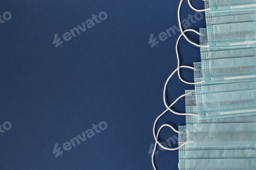 Preview: Medical surgical facial mask. Medical protective masks on a blue background. Protection concept.