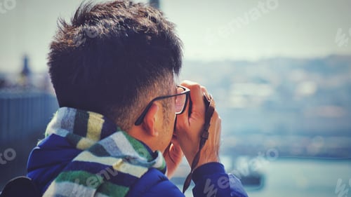 Preview: An asian tourist in Istanbul taking photos with a digital camera