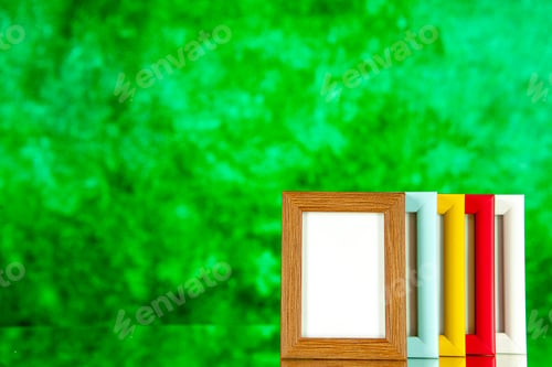 Preview: front view different picture frames with colored corners on green background family memory glass