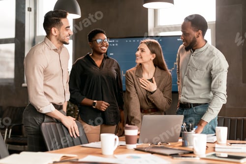 Preview: Colleagues having meeting in boardroom, working on a project
