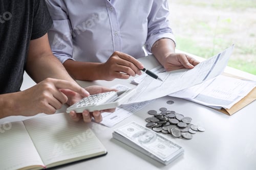 Preview: People Reviewing Finances and Calculating Budget Together
