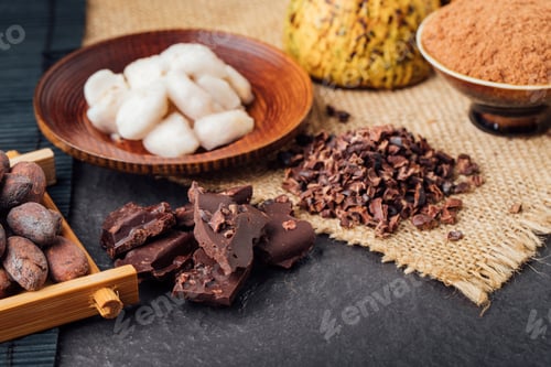 Preview: Cocoa beans and cocoa pod on a wooden surface.