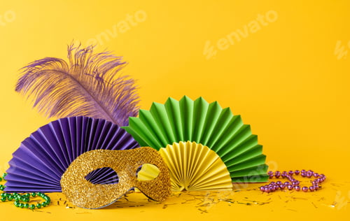 Preview: Decorative side view golden mask with green and purple fan ornaments symbolizing