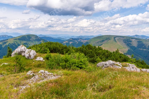 Preview: Scenic view of green mountains against the backdrop of a cloudy sky. Big Fatra mountains, Slovakia.