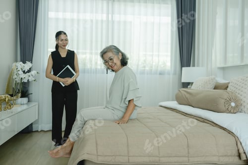 Preview: Real estate agent consulting elderly customer inside modern home