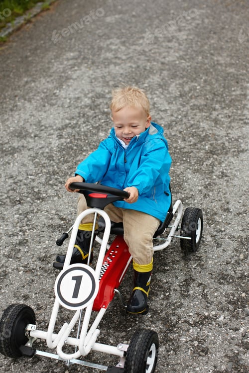 Preview: Toddler boy riding go-cart