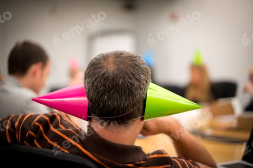 Preview: Office party - office worker with party hat