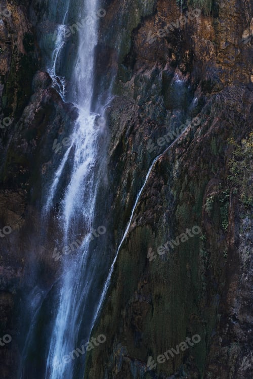 Preview: Grand waterfall cascading down a cliff