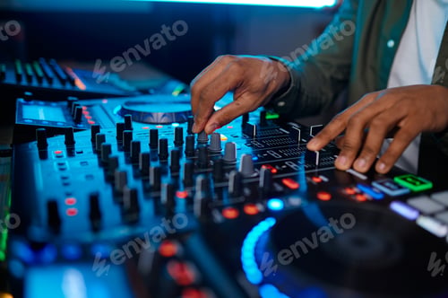 Preview: Closeup male hand on sound mixer console