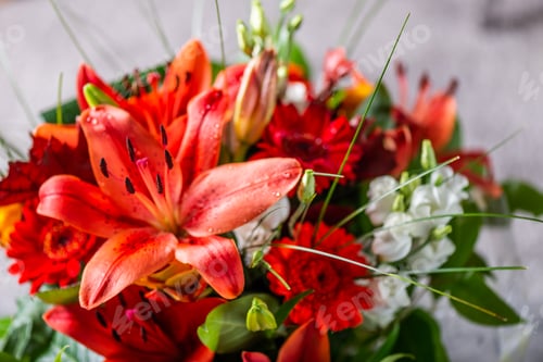 Preview: Vibrant Bouquet of orange Asiatic lilies and other flowers
