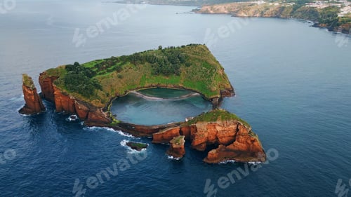 Preview: Isolated island seascape drone shot. Breathtaking rocky cape with sea lagoon