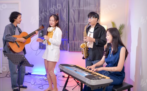 Preview: Young Asian band performing music indoors with guitar, keyboard, saxophone, and vocals