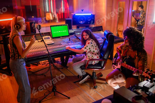 Preview: Recording session with three musicians and sound technician in music studio.