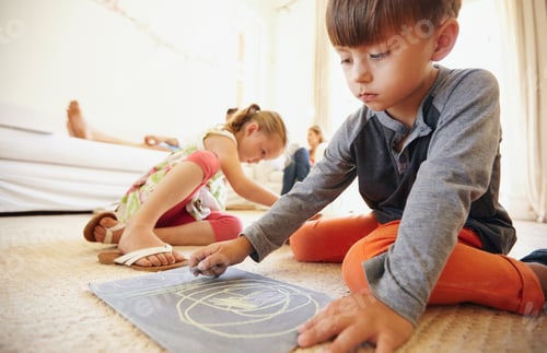 Preview: Children Drawing Together on Floor Indoors at Home