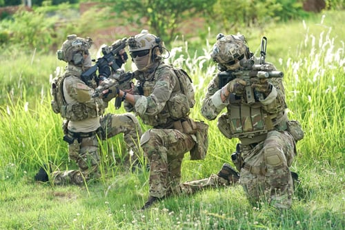 Preview: Soldier in full US MARSOC armed with assault rifle run through the abandoned building. Military