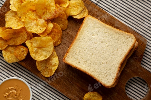 Preview: Homemade American Peanut Butter Sandwich on a Wooden Board, top view.
