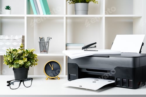 Preview: Workplace with modern printer and clock in the office