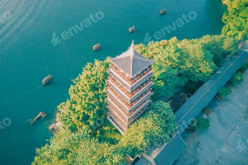 Preview: three boats floating down a large river next to trees and a pagoda