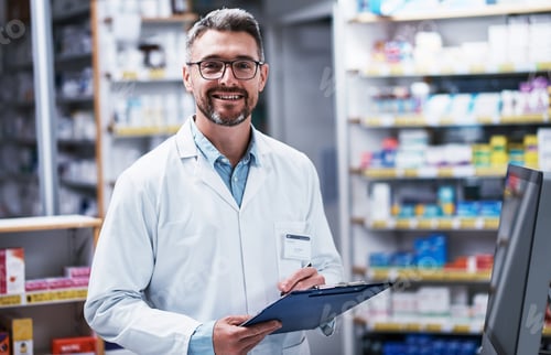 Preview: What can I do for you today. Portrait of a mature pharmacist writing on a clipboard in a pharmacy.