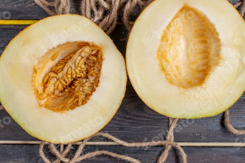 Preview: top view sliced melon half-cut sweet fruit on the brown background fruit juice fresh summer wood