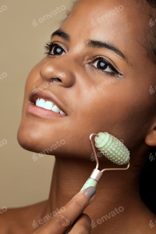 Preview: Woman using a handheld massaging tool