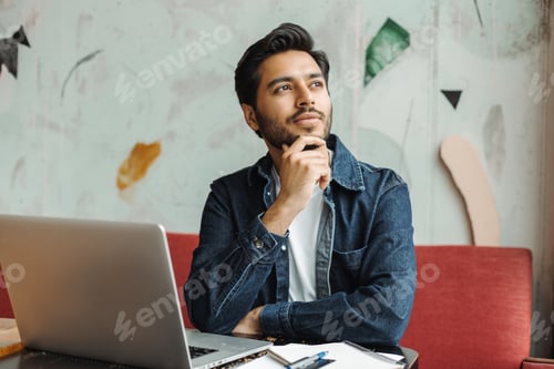 Preview: Pensive entrepreneur thinking new ideas for startup project in cafe