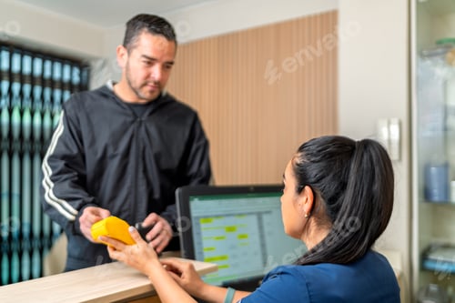 Preview: Patient making payment for physical therapy session
