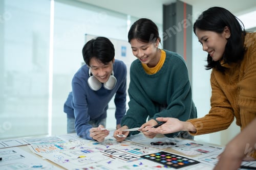 Preview: Asian team ux developer and ui designer brainstorming about mobile app interface wireframe design on