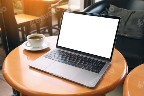 Preview: Mockup image of laptop computer with blank white desktop screen on wooden table