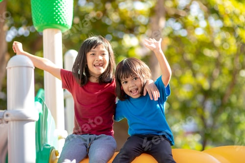 Preview: Child playing on the outdoor playground. Kids play in school or kindergarten yard.