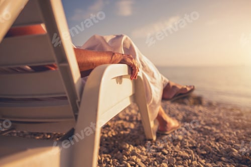 Preview: Relaxing on a Beach at Sunset in Lounge Chair