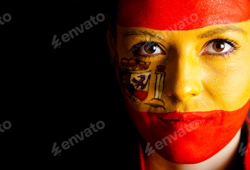 Preview: Spanish Woman With The Flag Painted On Her Face ? Isolated Over A Black Background