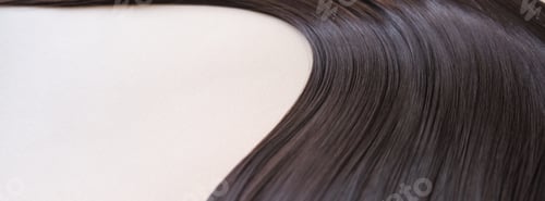 Preview: texture of beautiful glossy long hair.Curl female healthy hair.