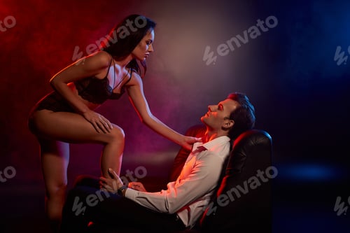 Preview: Captivating embrace between a passionate couple in a moody atmosphere filled with allure
