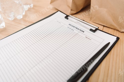 Preview: close-up shot of blank registration form on clipboard