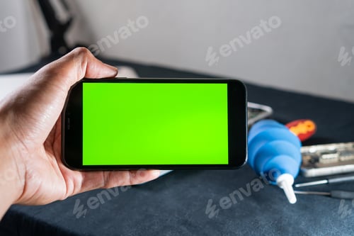 Preview: Hand Holding Smart phone with Green Screen