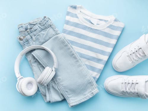 Preview: Child's t-shirt, shoes and headphones on blue backgrund
