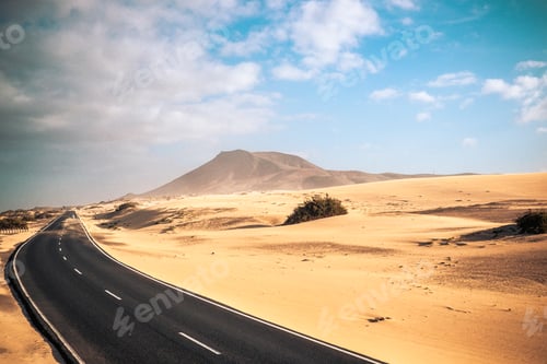 Preview: Travel on the road concept with long way asphalt road in the middle of the dunes sandy desert