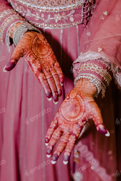 Preview: Close-up of the female hands with intricate henna artwork
