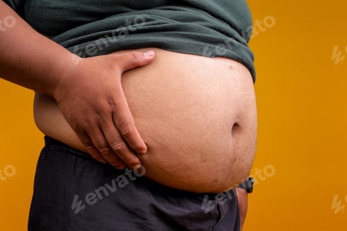 Preview: Overweight Problem. Man With Excessive Belly Fat on Yellow Background.