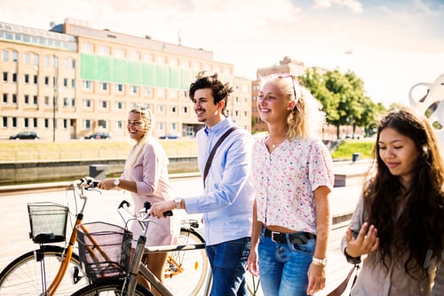 Preview: Friends enjoying a sunny day out with bicycles in the city