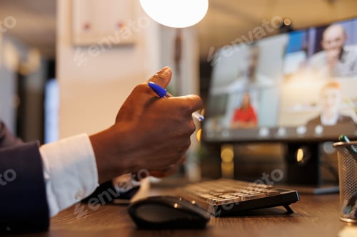 Preview: Businessman discussing financial statistics with remote team