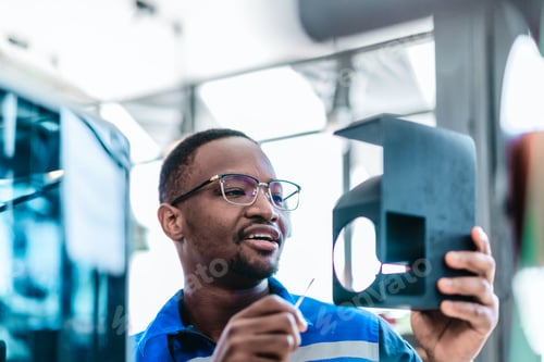 Preview: Engineer Inspecting 3D Printed Part