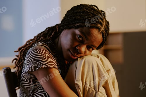 Preview: Contemplating African American Woman Sitting on Chair