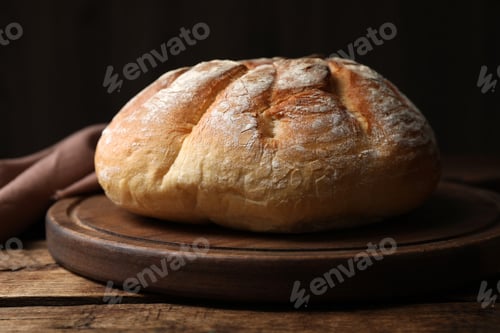 Preview: Loaf of tasty wheat sodawater bread on wooden table