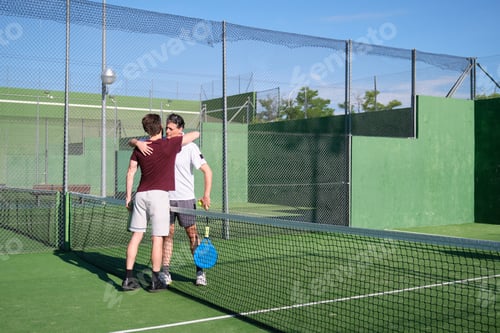 Preview: Two padel players hugging each other after a padel match