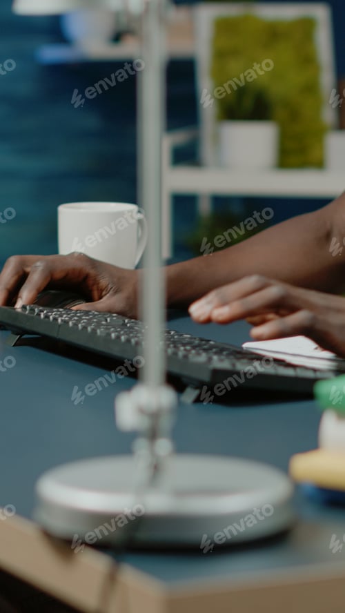 Preview: Close up of architect using keyboard and computer